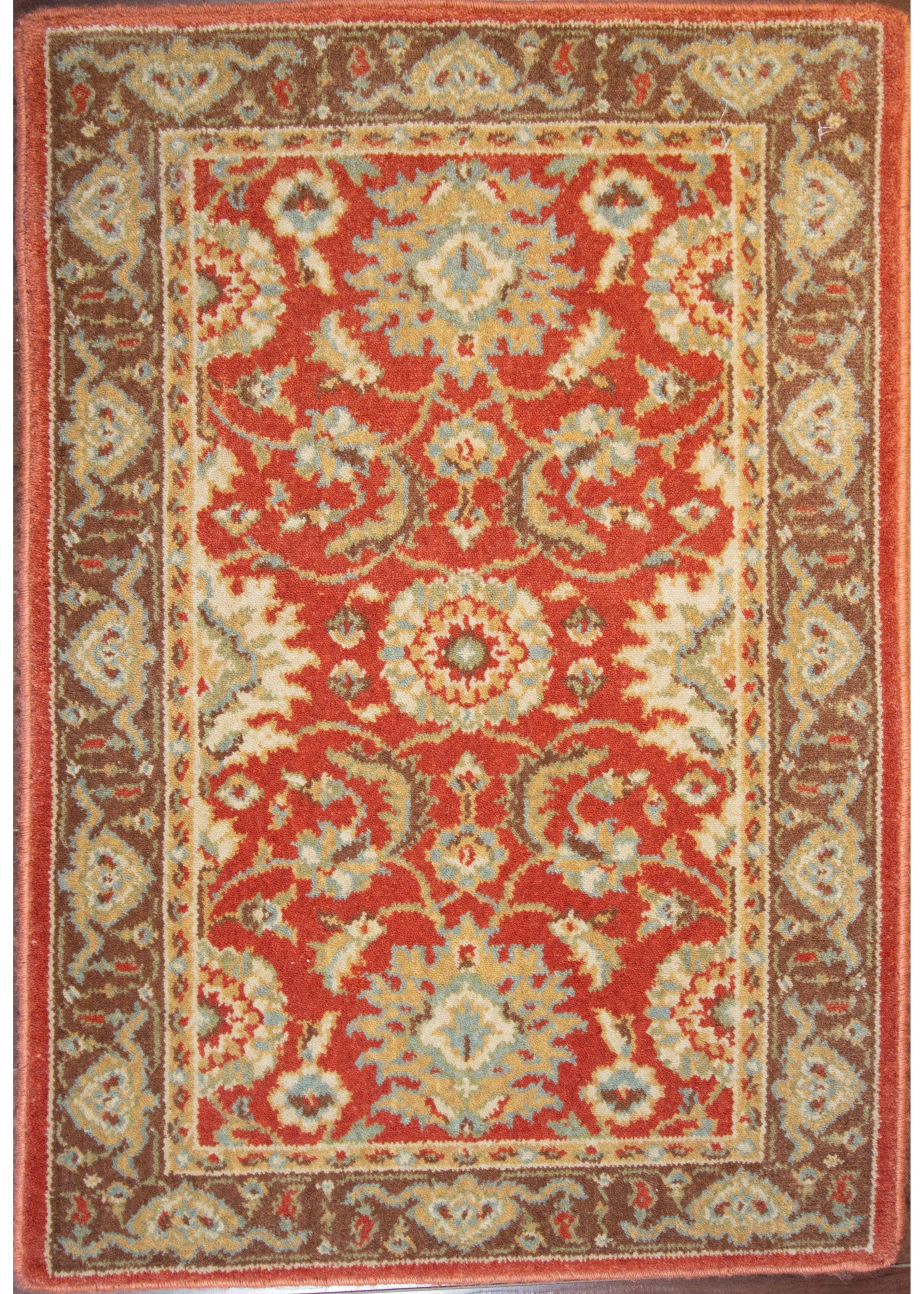 Calcutta Red/Brown Wool Loomed Indian Rug, featuring Red tones and Floral design, ideal area rug for any room in your home.